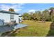 Spacious backyard with patio, grass, and storage shed at 8466 Maureen Ave, North Port, FL 34287