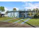Ranch style home with a carport, and nicely landscaped yard at 8466 Maureen Ave, North Port, FL 34287