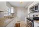 Efficient kitchen featuring white cabinets and granite countertops at 8466 Maureen Ave, North Port, FL 34287