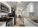 Modern kitchen with stainless steel appliances and ample counter space at 8466 Maureen Ave, North Port, FL 34287