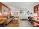 Cozy living room with tiled floors, and access to a screened porch at 8466 Maureen Ave, North Port, FL 34287