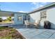 Cozy patio with seating area and grill, adjacent to house at 8466 Maureen Ave, North Port, FL 34287