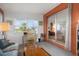 Bright sunroom with sliding glass doors and view of backyard at 8466 Maureen Ave, North Port, FL 34287