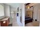 Main bathroom with shower and view into bedroom at 8773 Stone Harbour Loop, Bradenton, FL 34212