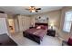 King-size bed, ensuite bathroom access, and neutral decor at 8773 Stone Harbour Loop, Bradenton, FL 34212
