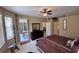 Bedroom with king bed, dresser, and patio access at 8773 Stone Harbour Loop, Bradenton, FL 34212