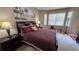 King size bed, dresser, and window overlooking the backyard at 8773 Stone Harbour Loop, Bradenton, FL 34212