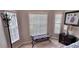 Bedroom corner showing a seating bench and large windows at 8773 Stone Harbour Loop, Bradenton, FL 34212