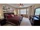 King bed, dresser, and access to private bathroom at 8773 Stone Harbour Loop, Bradenton, FL 34212