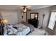 Well-lit bedroom with a queen bed and dresser at 8773 Stone Harbour Loop, Bradenton, FL 34212
