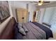 Spacious bedroom with king-size bed and sitting area at 8773 Stone Harbour Loop, Bradenton, FL 34212