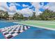 Outdoor bocce ball court with checkerboard and seating areas at 8773 Stone Harbour Loop, Bradenton, FL 34212