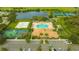 Aerial view of community pool, tennis courts, and clubhouse at 8773 Stone Harbour Loop, Bradenton, FL 34212