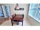 Small dining area with wood table and four chairs at 8773 Stone Harbour Loop, Bradenton, FL 34212