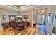 Bright dining room with hardwood floors and a large table at 8773 Stone Harbour Loop, Bradenton, FL 34212