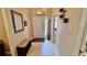 Bright entryway with tiled floor and coat rack at 8773 Stone Harbour Loop, Bradenton, FL 34212