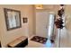 Inviting entryway with a bench, mirror, and coat rack at 8773 Stone Harbour Loop, Bradenton, FL 34212
