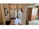 Bright entryway with tiled floor and coat rack at 8773 Stone Harbour Loop, Bradenton, FL 34212