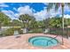 Relaxing hot tub surrounded by comfortable seating and fencing at 8773 Stone Harbour Loop, Bradenton, FL 34212