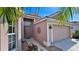 Front entrance with walkway, decorative metalwork and ADT security system at 8773 Stone Harbour Loop, Bradenton, FL 34212