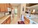 Open concept kitchen with island and stainless steel appliances at 8773 Stone Harbour Loop, Bradenton, FL 34212