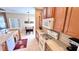 Kitchen features wood cabinets, gas range, and a dishwasher at 8773 Stone Harbour Loop, Bradenton, FL 34212