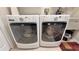 Modern laundry room with two matching Whirlpool washing machines at 8773 Stone Harbour Loop, Bradenton, FL 34212