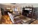 Spacious living room with hardwood floors and comfortable reclining furniture at 8773 Stone Harbour Loop, Bradenton, FL 34212