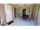 Covered patio with table and chairs, adjacent to pool and spa at 8773 Stone Harbour Loop, Bradenton, FL 34212