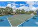 Outdoor shuffleboard court with benches and surrounding landscaping at 8773 Stone Harbour Loop, Bradenton, FL 34212