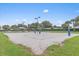 Outdoor sand volleyball court with nets and lights at 8773 Stone Harbour Loop, Bradenton, FL 34212