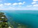 Aerial view of waterfront property with a private dock and lush landscaping at 974 32Nd St, Sarasota, FL 34234