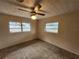 Spacious bedroom with wall-to-wall carpet and ceiling fan at 975 S Tuttle Ave, Sarasota, FL 34237