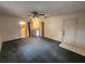 Carpeted bedroom with access to a bathroom and hallway at 975 S Tuttle Ave, Sarasota, FL 34237