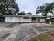 House exterior showcasing a two-car garage and a neat front yard at 975 S Tuttle Ave, Sarasota, FL 34237