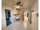 Laundry room with tile floors, a utility sink, and built-in cabinets at 975 S Tuttle Ave, Sarasota, FL 34237