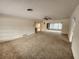 Bright living room with carpeted floors and ceiling fan at 975 S Tuttle Ave, Sarasota, FL 34237