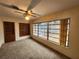 Bright living room featuring built-in shelving and large windows at 975 S Tuttle Ave, Sarasota, FL 34237