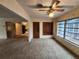 Open living area with built-in shelving and view into adjacent room at 975 S Tuttle Ave, Sarasota, FL 34237