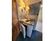 Small wet bar with sink, countertop, and mini-refrigerator at 975 S Tuttle Ave, Sarasota, FL 34237