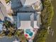 Bird's-eye view showing house, pool, and canal at 114 Gull Dr, Anna Maria, FL 34216