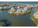 Waterfront property with lush landscaping and private dock at 114 Gull Dr, Anna Maria, FL 34216