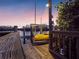Private dock with kayak lift at sunset at 114 Gull Dr, Anna Maria, FL 34216