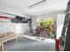 Garage with various storage items and bikes at 114 Gull Dr, Anna Maria, FL 34216