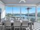 Relaxing screened deck with outdoor dining set and beautiful water views at 114 Gull Dr, Anna Maria, FL 34216