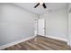 Bedroom with ceiling fan and door to another room at 1010 E Lake Ave, Tampa, FL 33605