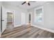 Spacious bedroom featuring light grey walls and wood-look floors at 1010 E Lake Ave, Tampa, FL 33605