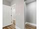 Clean hallway with light grey walls and wood-look floors at 1010 E Lake Ave, Tampa, FL 33605