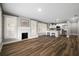 Open living space with hardwood floors and a fireplace at 1010 E Lake Ave, Tampa, FL 33605