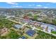 Aerial view of waterfront home with private pool and dock at 10508 Mcalester Cir, Port Charlotte, FL 33981